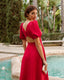 
Vestido Invitada fiesta  midi elegante  sol rojo falda vuelo escote espalda mangas abullonadas 